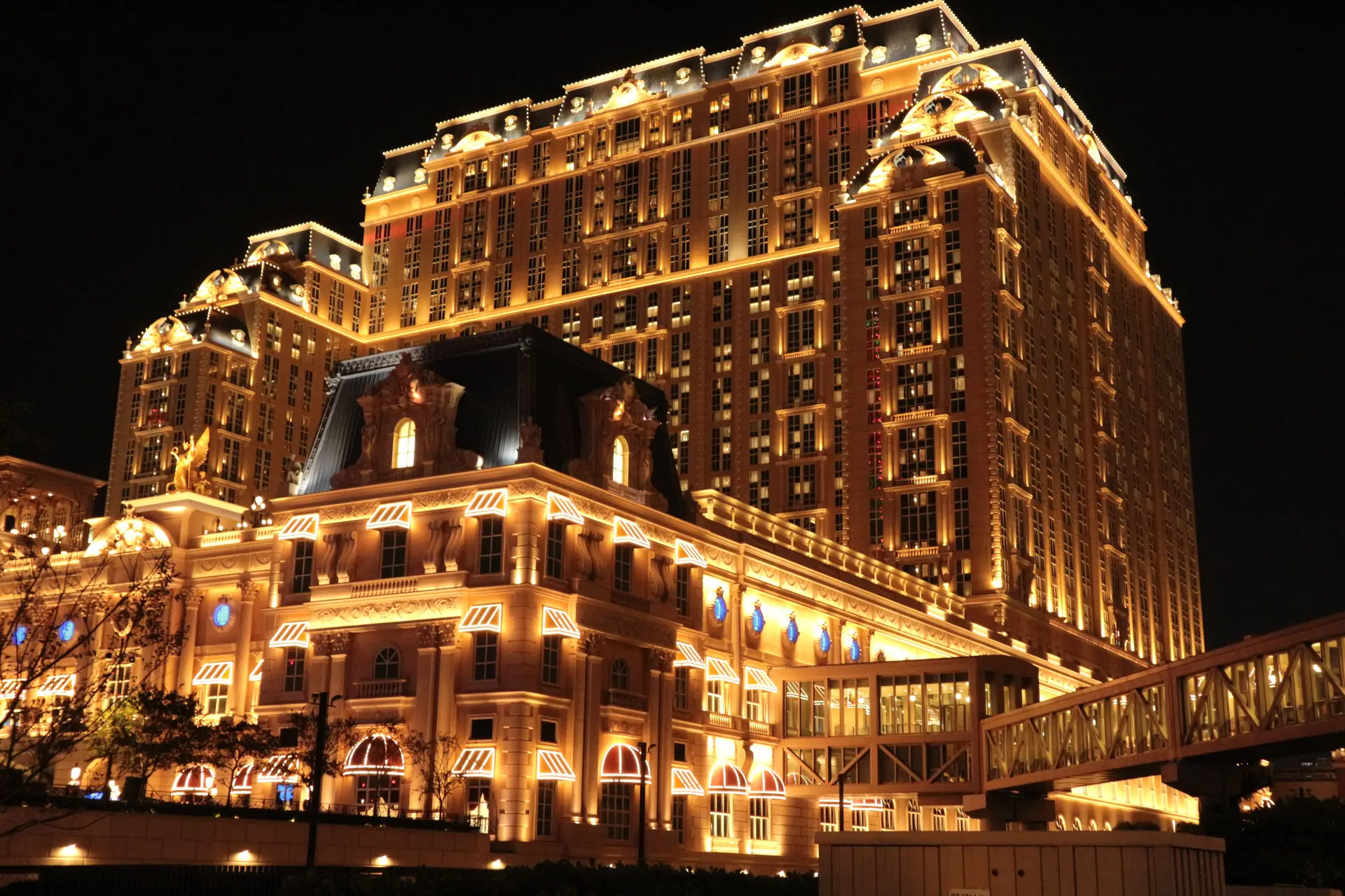 Illuminated facade of a luxury casino resort at twilight in Canada