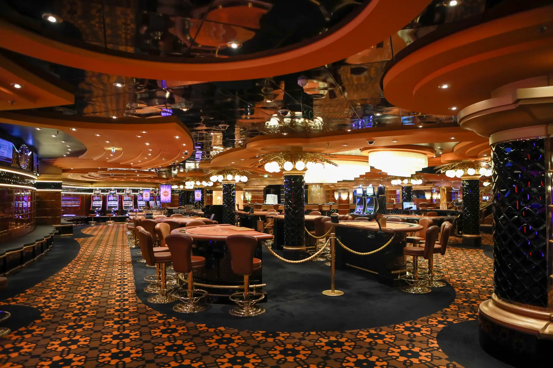 Elegant gaming floor lighting and polished slot machine rows