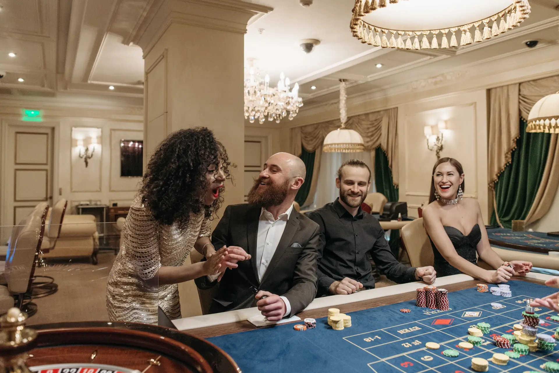 Guests seated at high-limit poker table with professional dealer